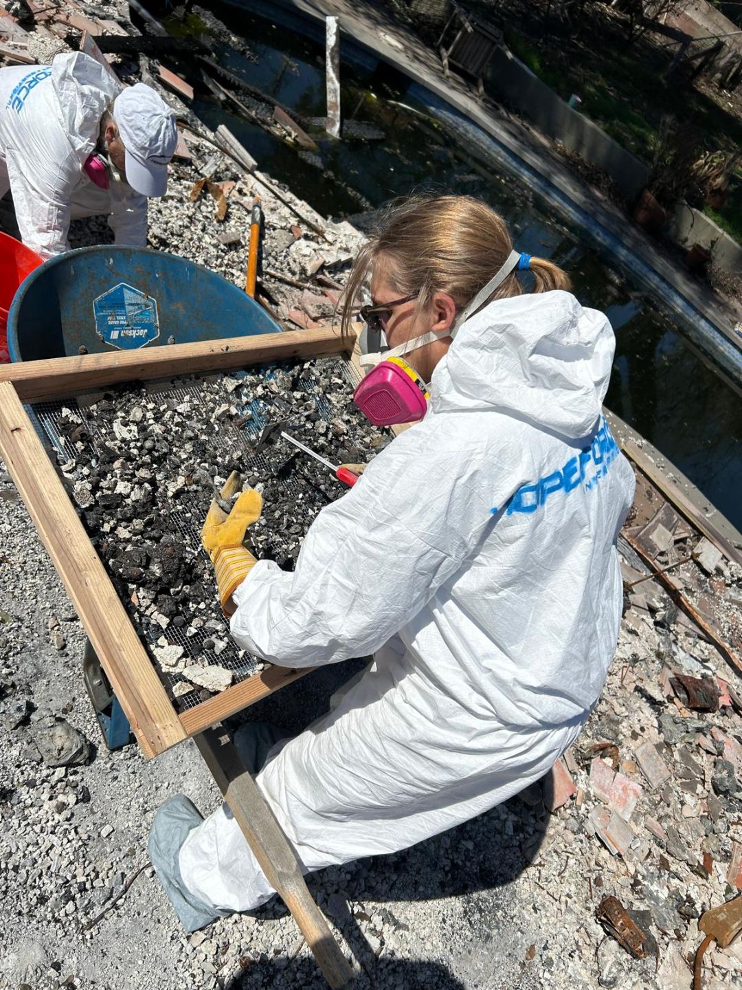 Hope Force Reservist sifting ash in California